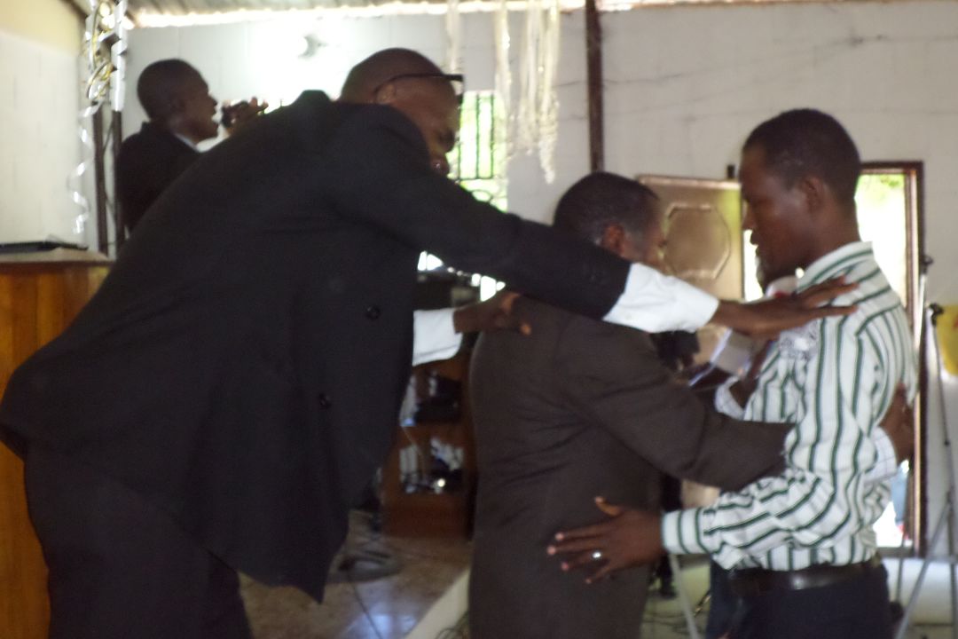 Laying on of hands in prayer